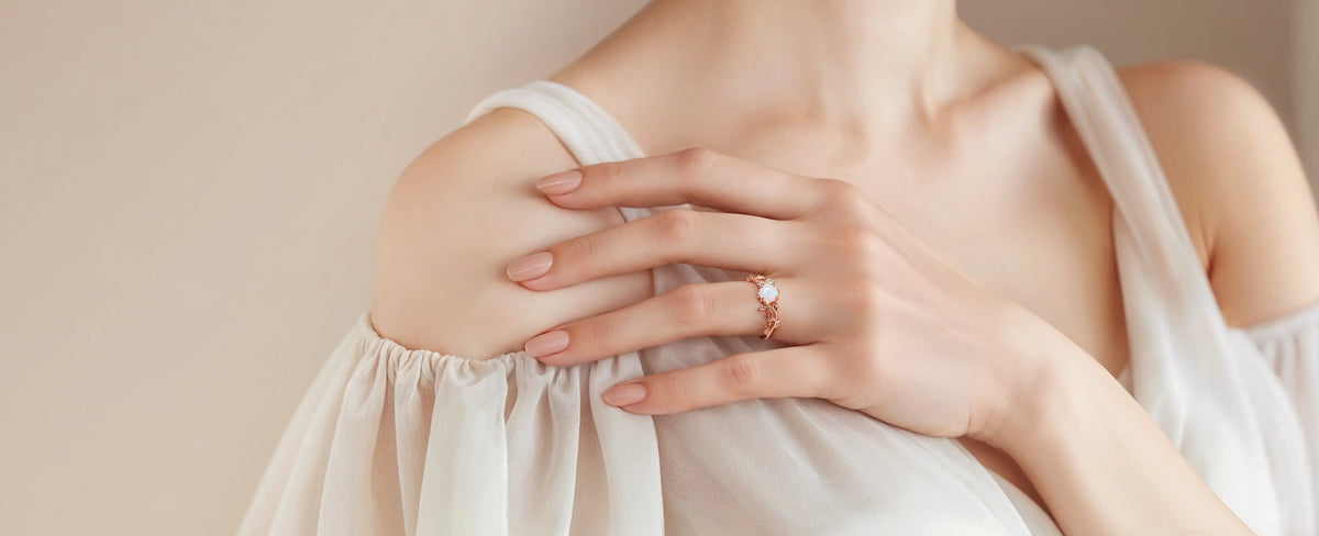Opal twig wedding ring on a woman hand