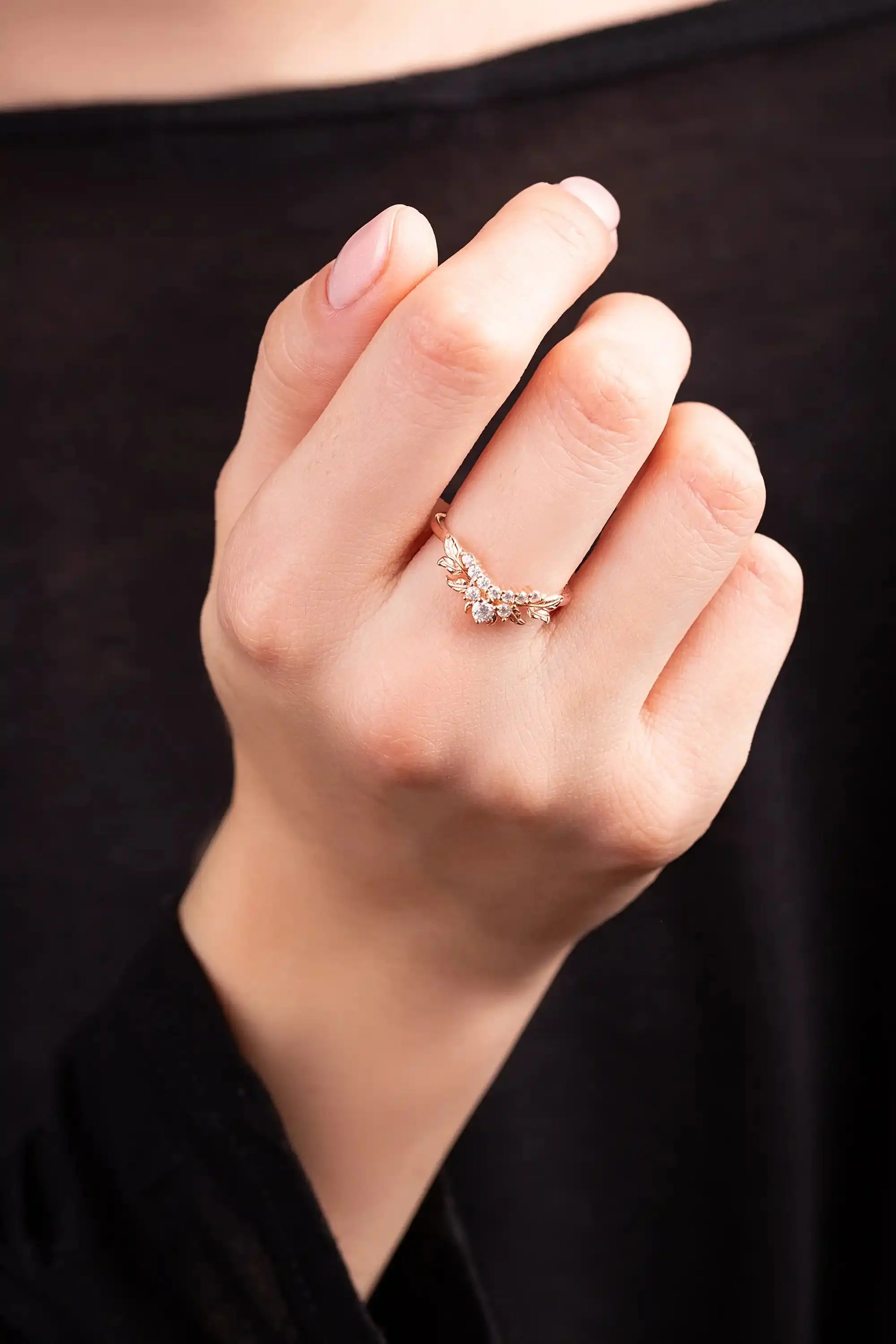 Yellow gold ring with moissanite twig on a woman's hand