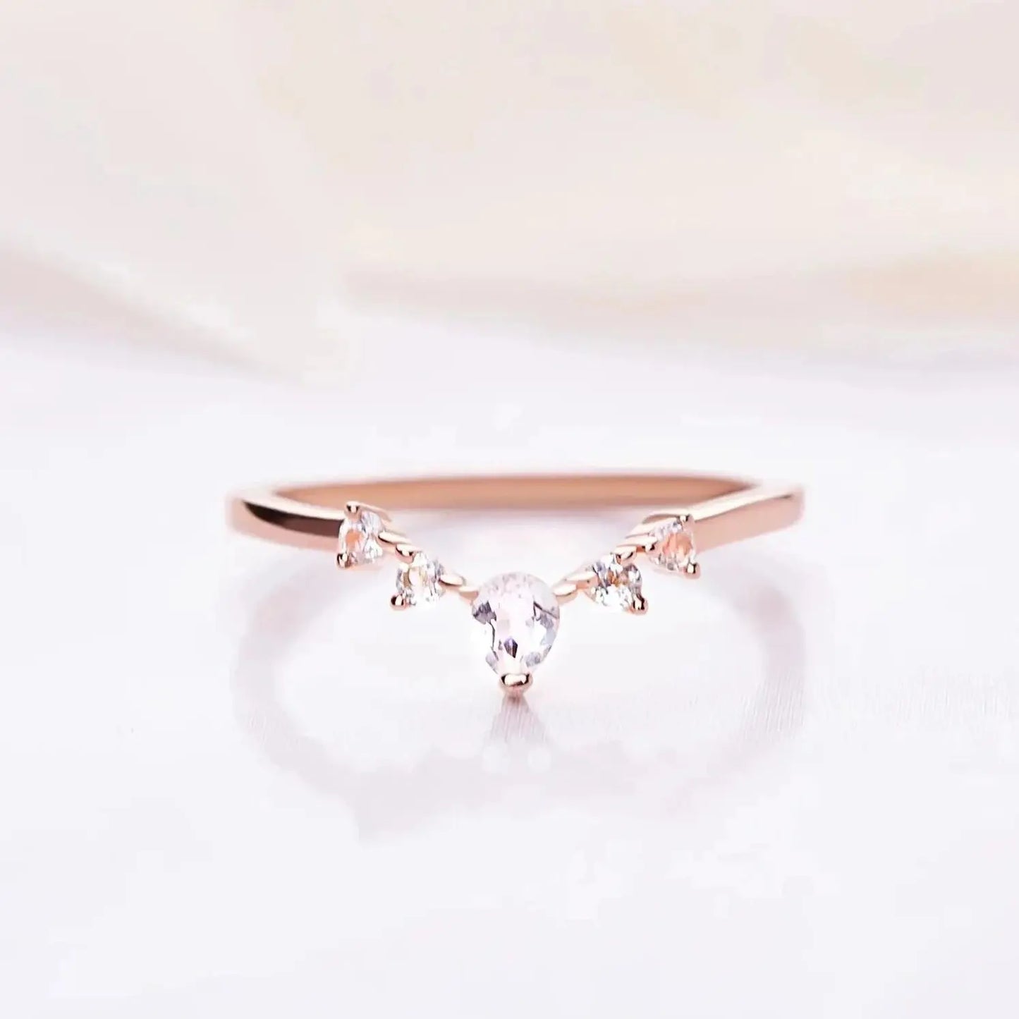 Yellow gold ring for women. Ring with zircon gemstones in a v-shape.