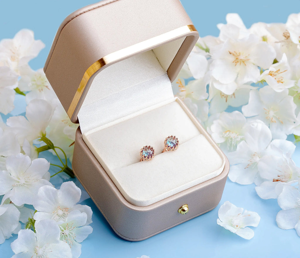 Alexandrite crown studs in a golden box