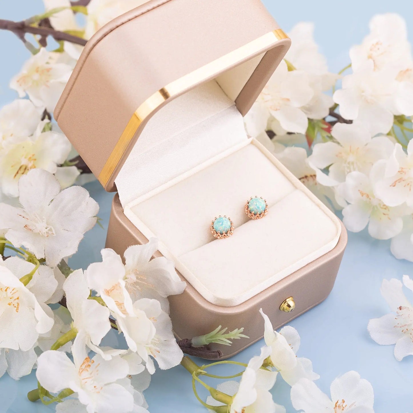 Two Green Opal crown studs in a gift box