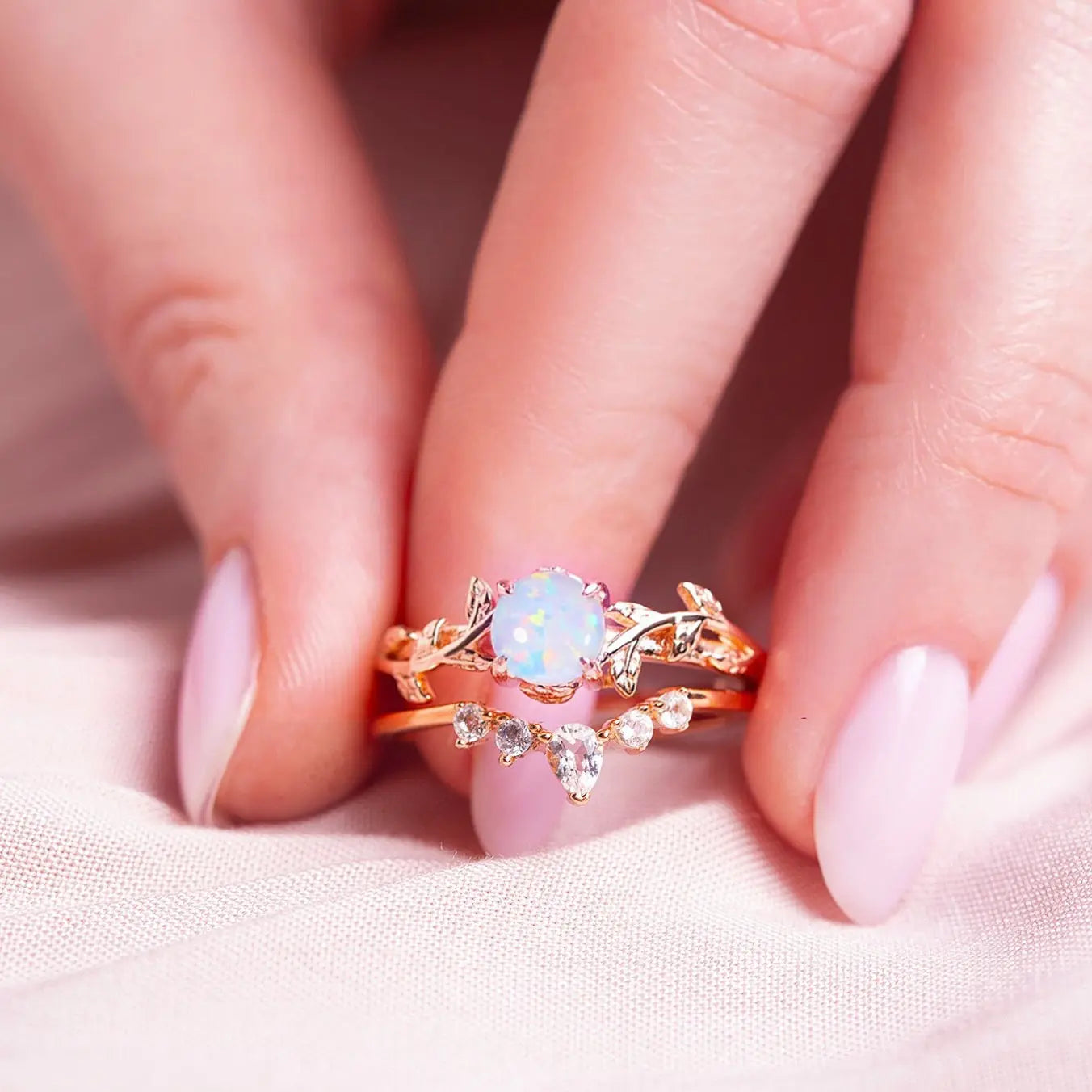 Silver Ring set for women. One ring in a form of twig with opal gemstone, another ring is v-shaped with zircon gemstones. Both rings are gold plated