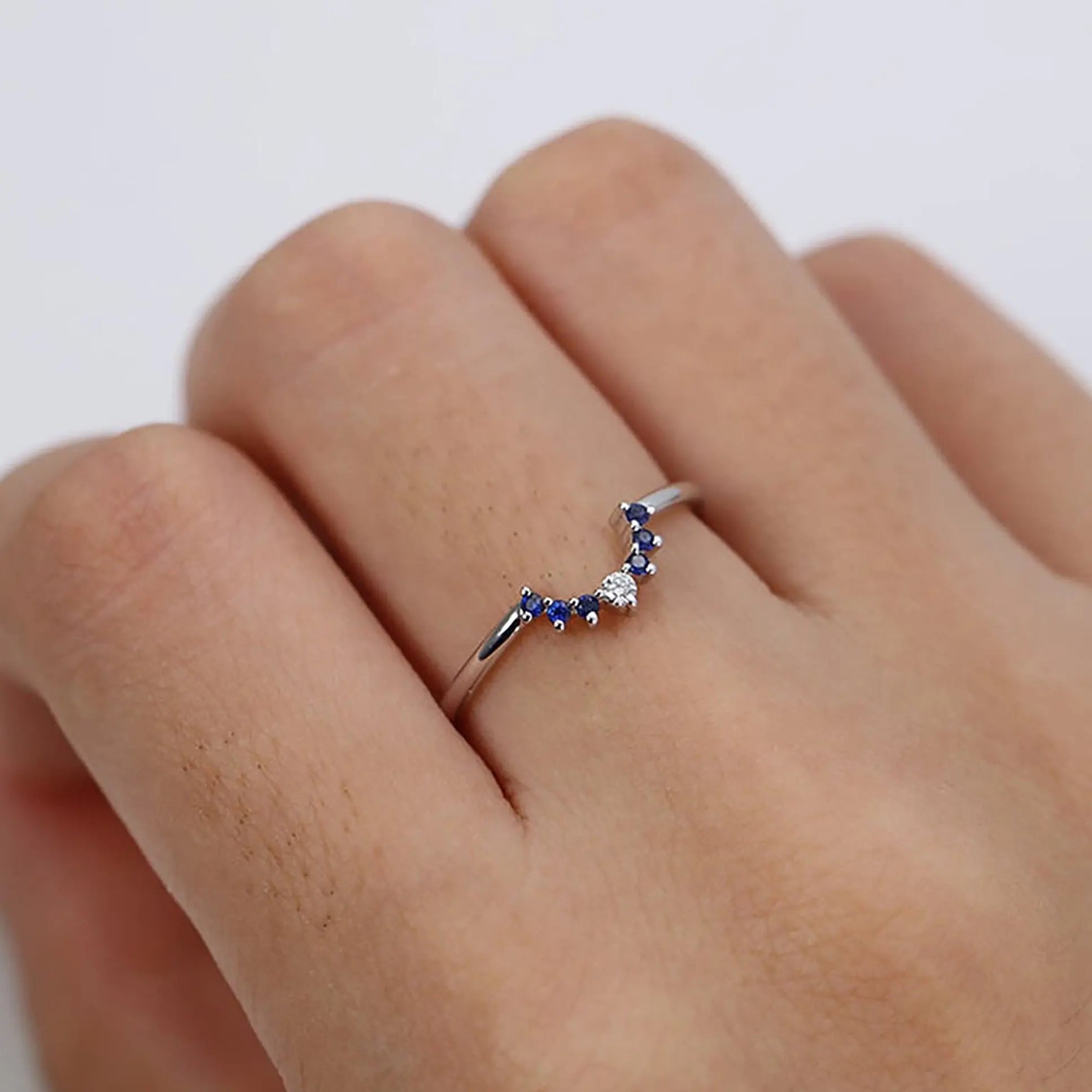 Blue Cubic Zirconia engagement ring on a woman hand
