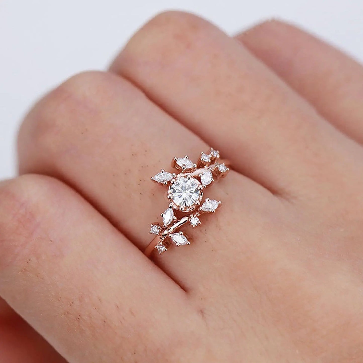 Moissanite & White Zircon engagement ring on a woman hand