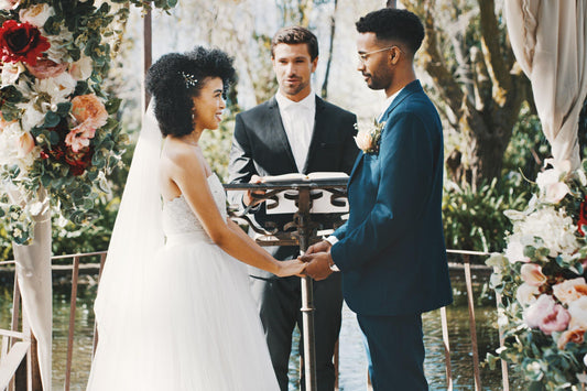 Bride and groom on a wedding ceremony in front of an arch