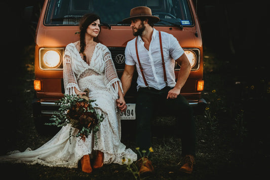 Couple sitting on a car in Fall Season