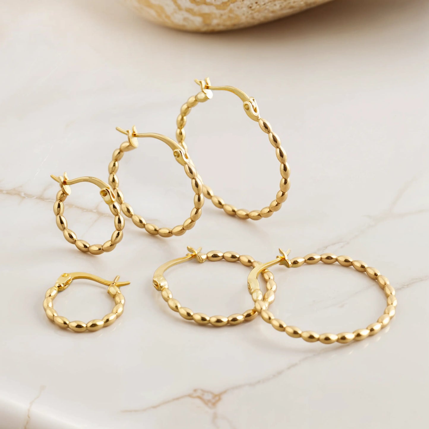 Three hoop earrings