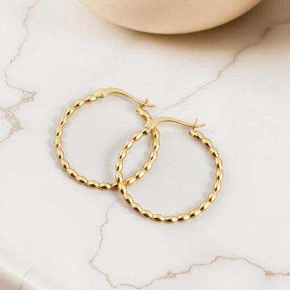 Three hoop earrings