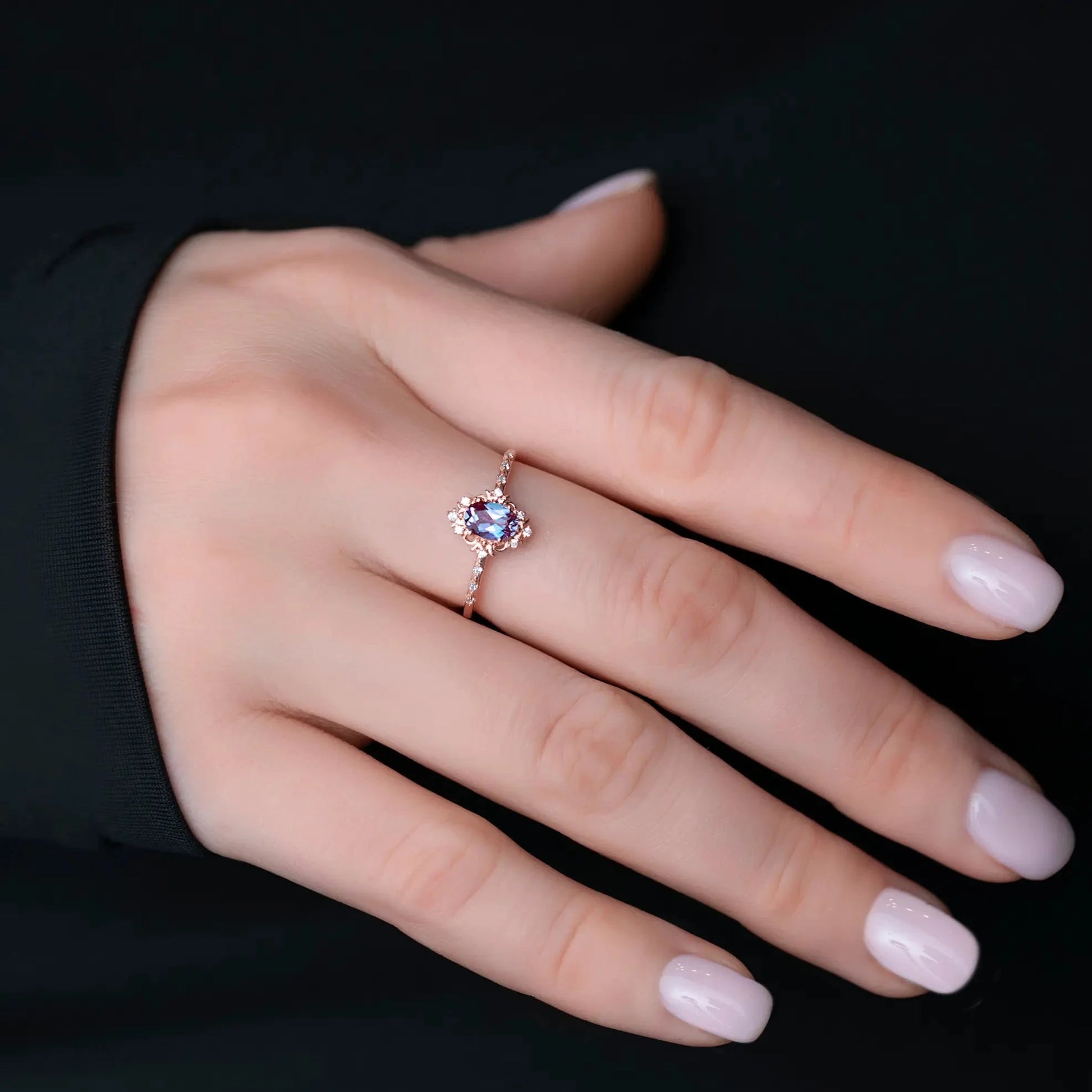 Аlexandrite wedding ring on a woman's finger