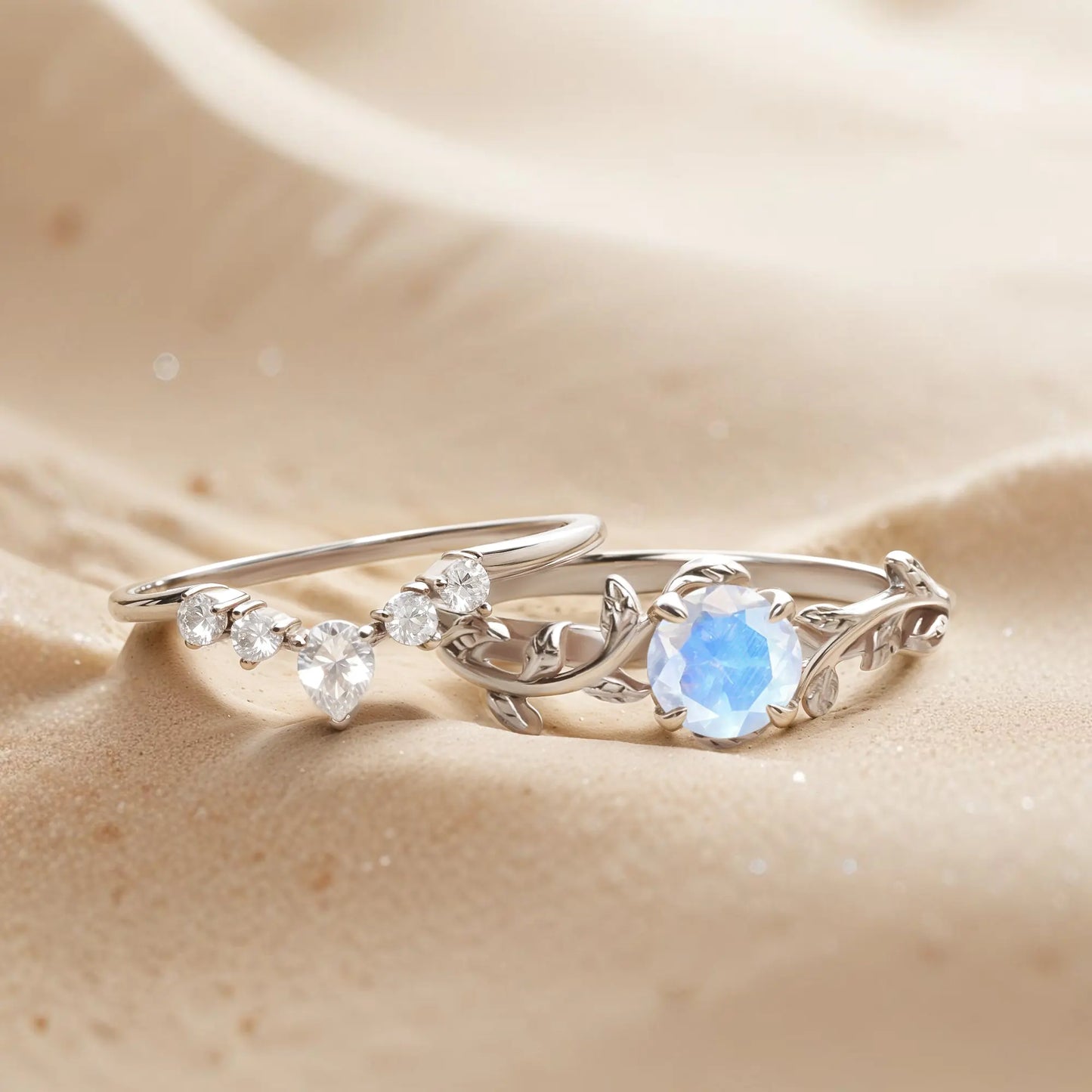 White Gold nature-inspired ring set with moonstone and topaz gemstones, featuring a twigs and leaf design for engagement or wedding rings.