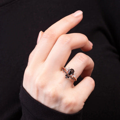 Black Quartz,&nbsp;White Topaz and Black Spinels ring set on a woman's hand