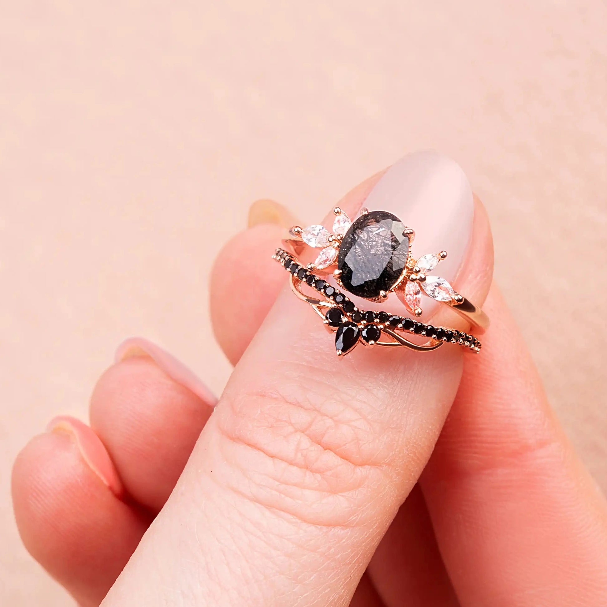 Black Quartz,&nbsp;White Topaz and Black Spinels ring set on a woman's finger