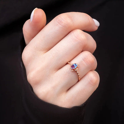 Аlexandrite wedding ring on a woman's hand
