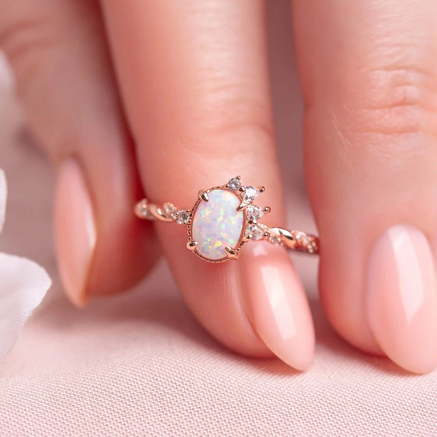 Opal Crown ring on a woman's finger