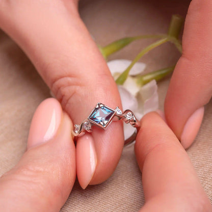 Princess Cut Alexandrite with a white gold on a woman's finger