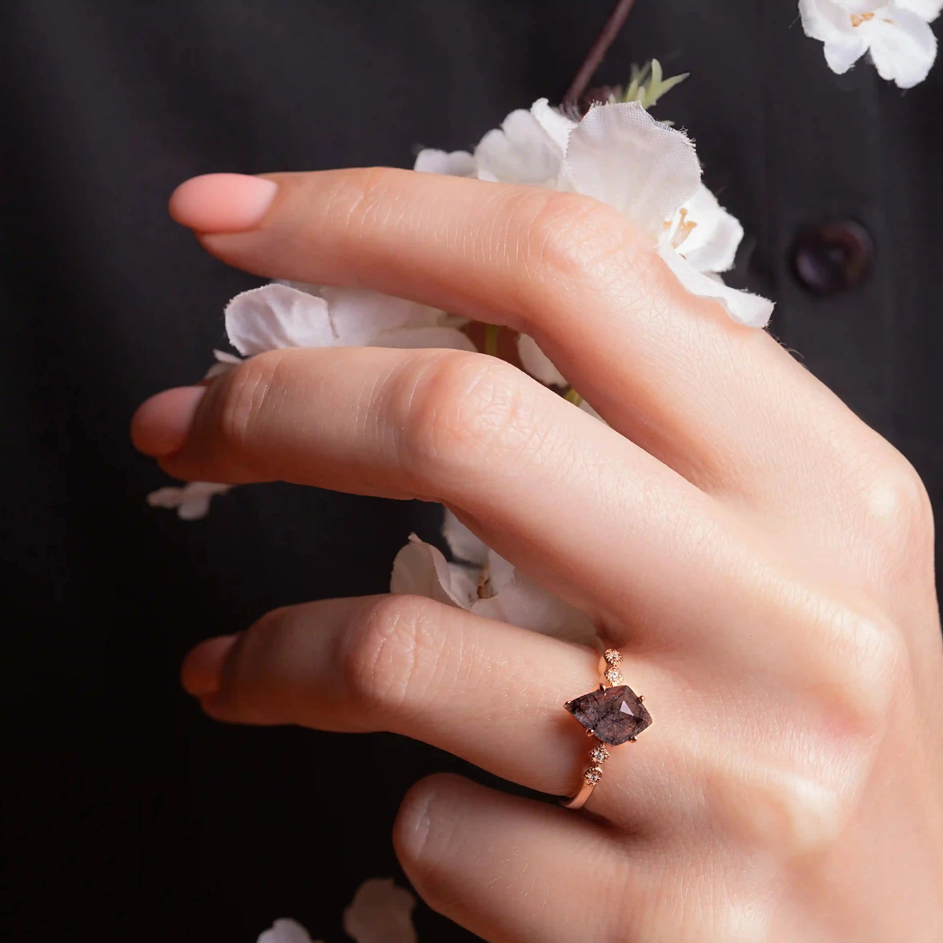 Kite cut Black Rutilated Quartz on a woman's hand