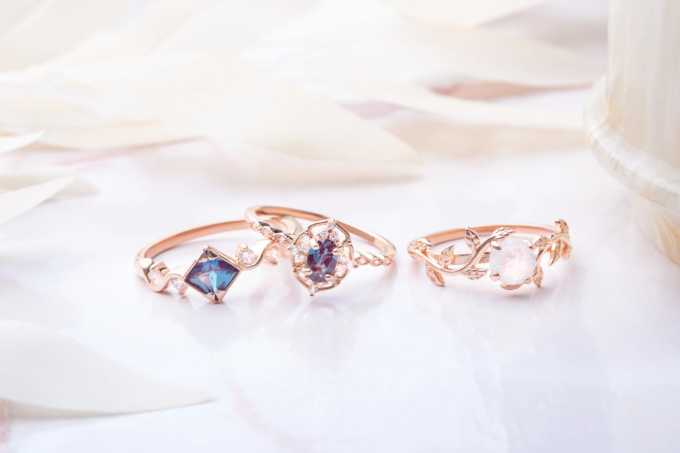 Three gold plated rings from Tenderness collection. Each ring has different gemstone, two rings have alexandrite and one ring has opal