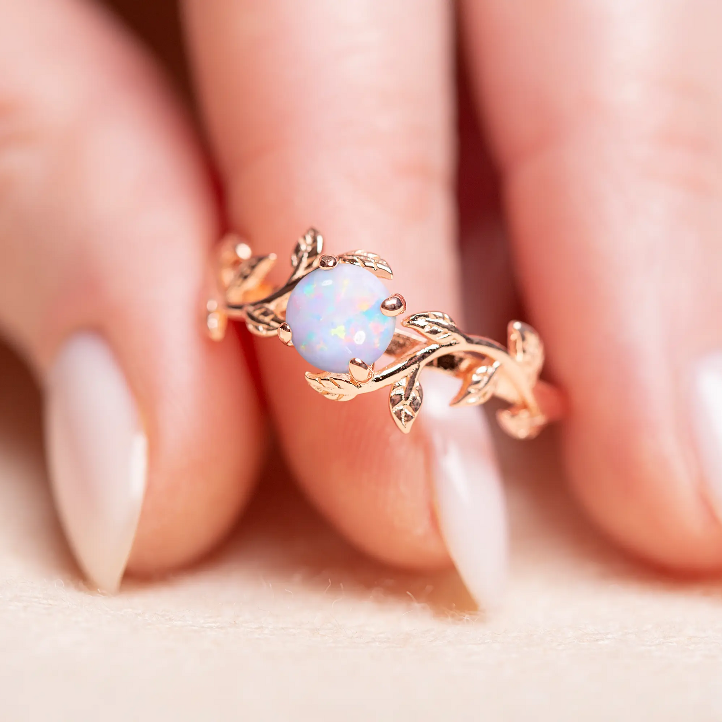 Unique promise ring with a twig-style band and a vibrant opal gemstone, ideal for engagements or a special occasion gift.