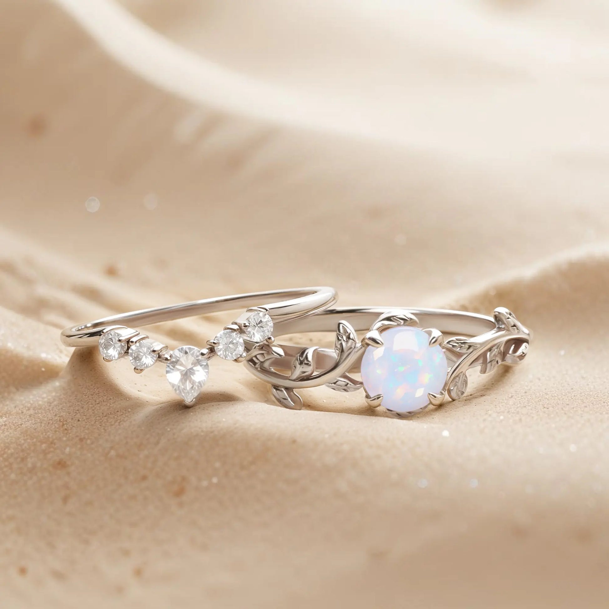 Nature-inspired White Gold Twigs Ring Set featuring opal and topaz gemstones with a delicate leaf design, perfect for engagements or weddings.