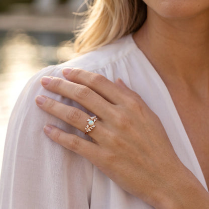 Close-up of a hand wearing a ring with a blurred background