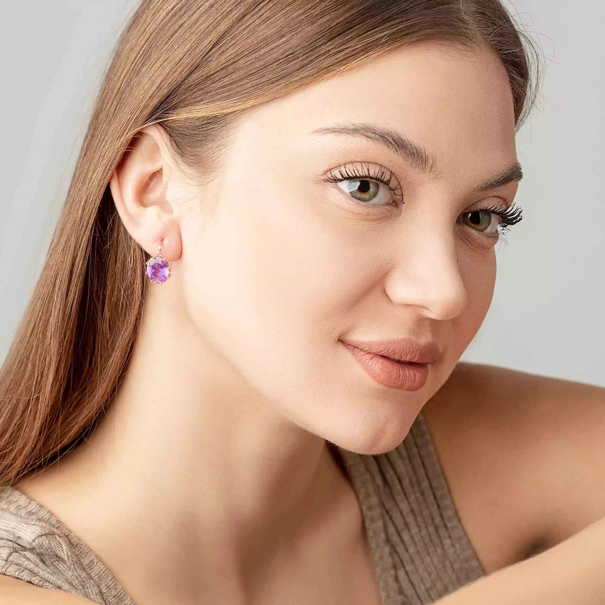Amethyst vintage earrings on a woman ears