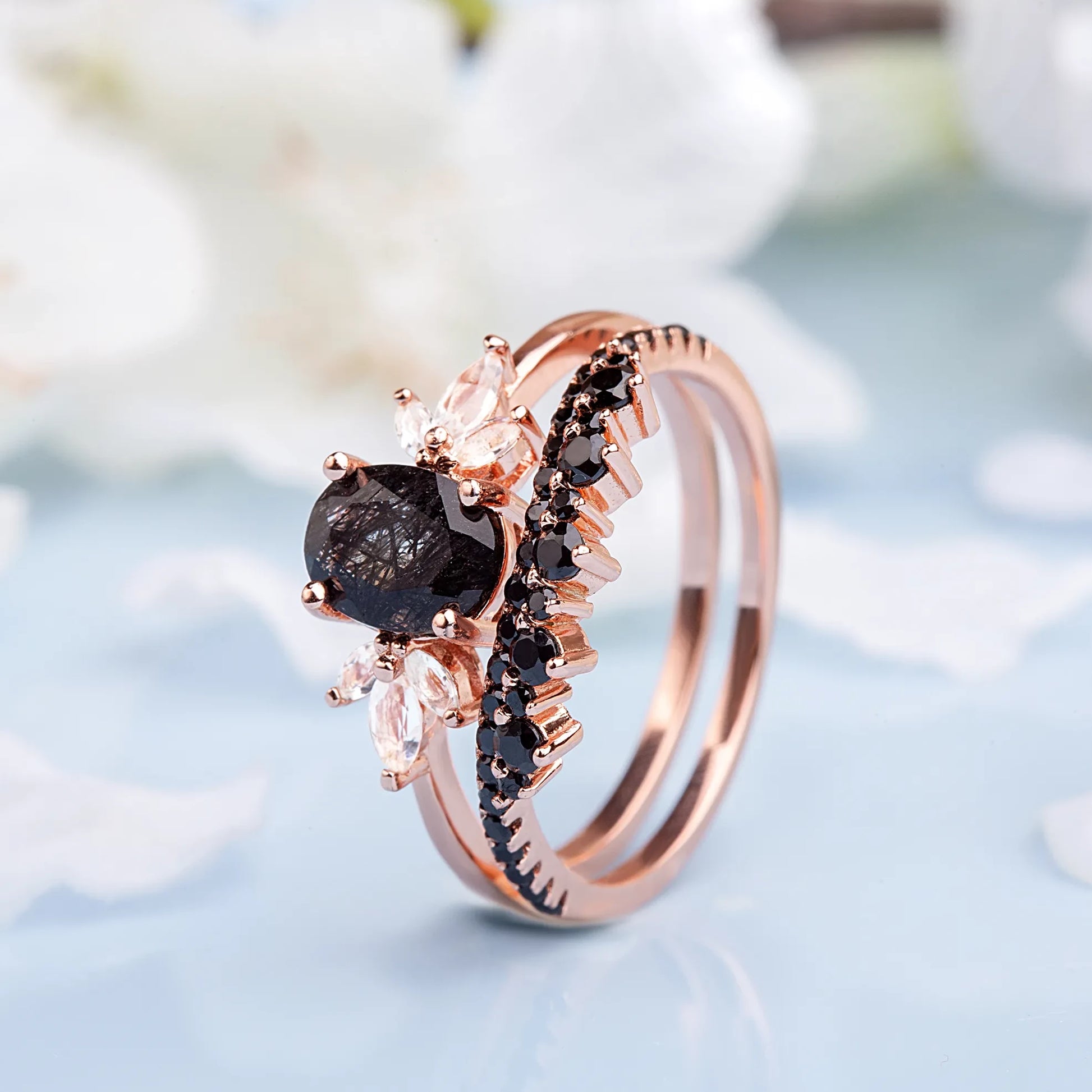 Stacking wedding ring set with black gemstones, featuring an elegant Black Rutilated Quartz engagement ring and matching band.