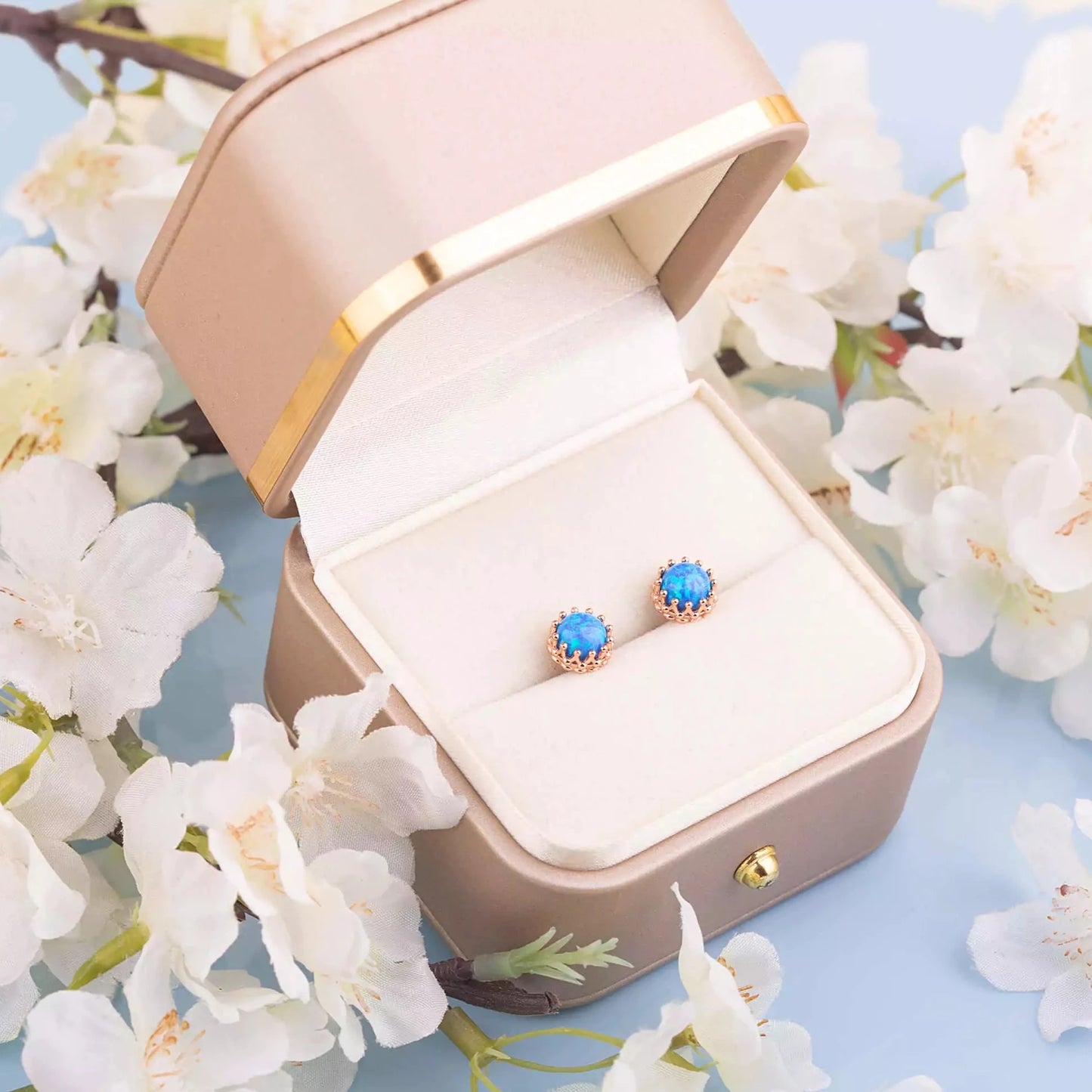 Blue opal crown studs in a gift box