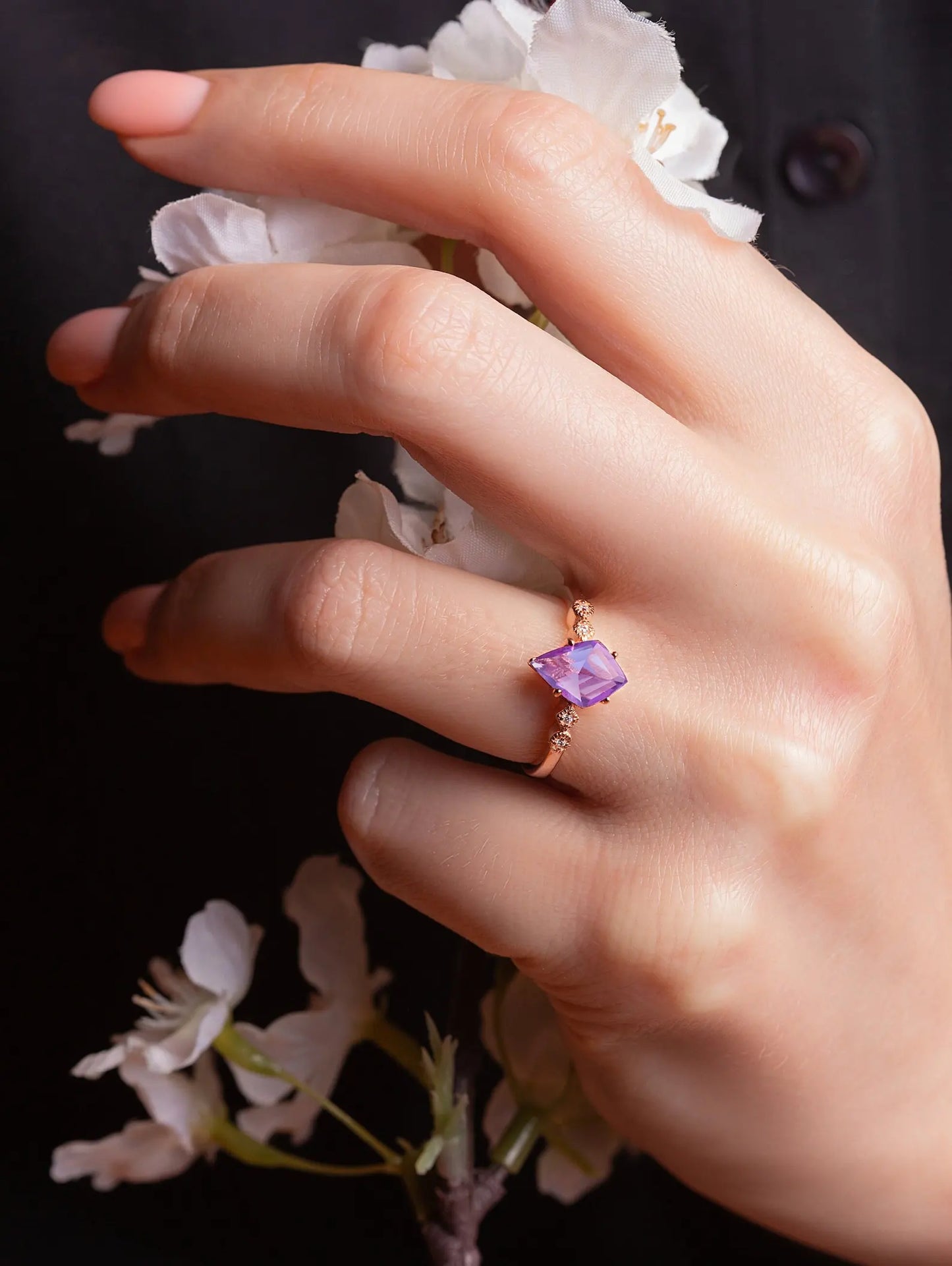 Amethyst and White Zircon ring on a woman's hand