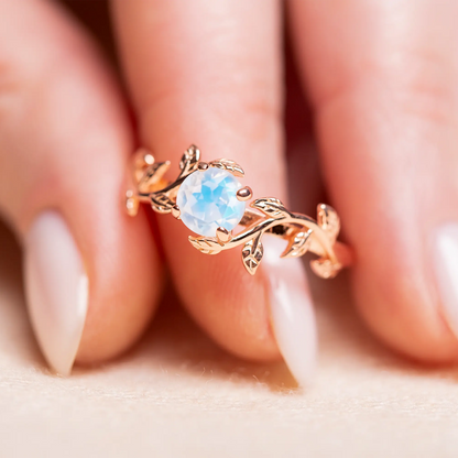 Nature-inspired twig ring with a radiant moonstone centerpiece, designed for engagements, promises, or daily wear jewelry.