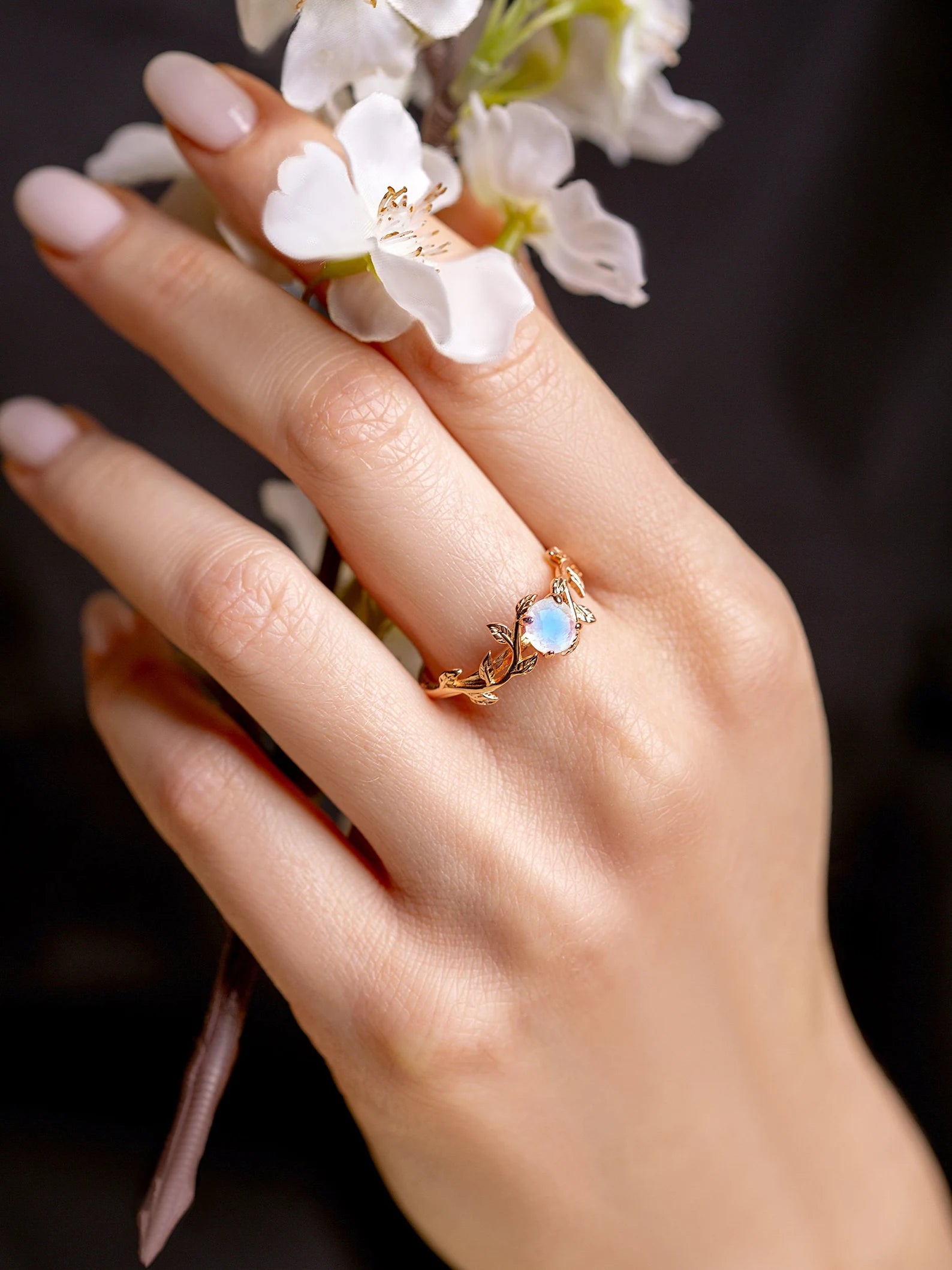 Nature-inspired twig ring with a radiant moonstone centerpiece, designed for engagements, promises, or daily wear jewelry.