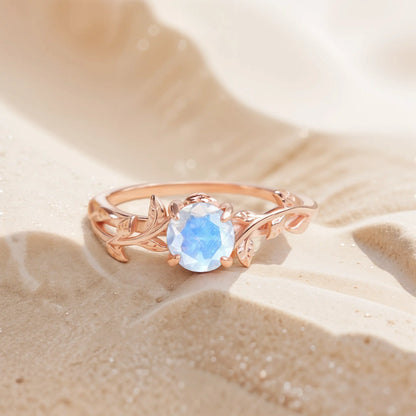 Unique leaf ring featuring a glowing moonstone, handcrafted with a nature-inspired design, perfect as an engagement or promise ring.