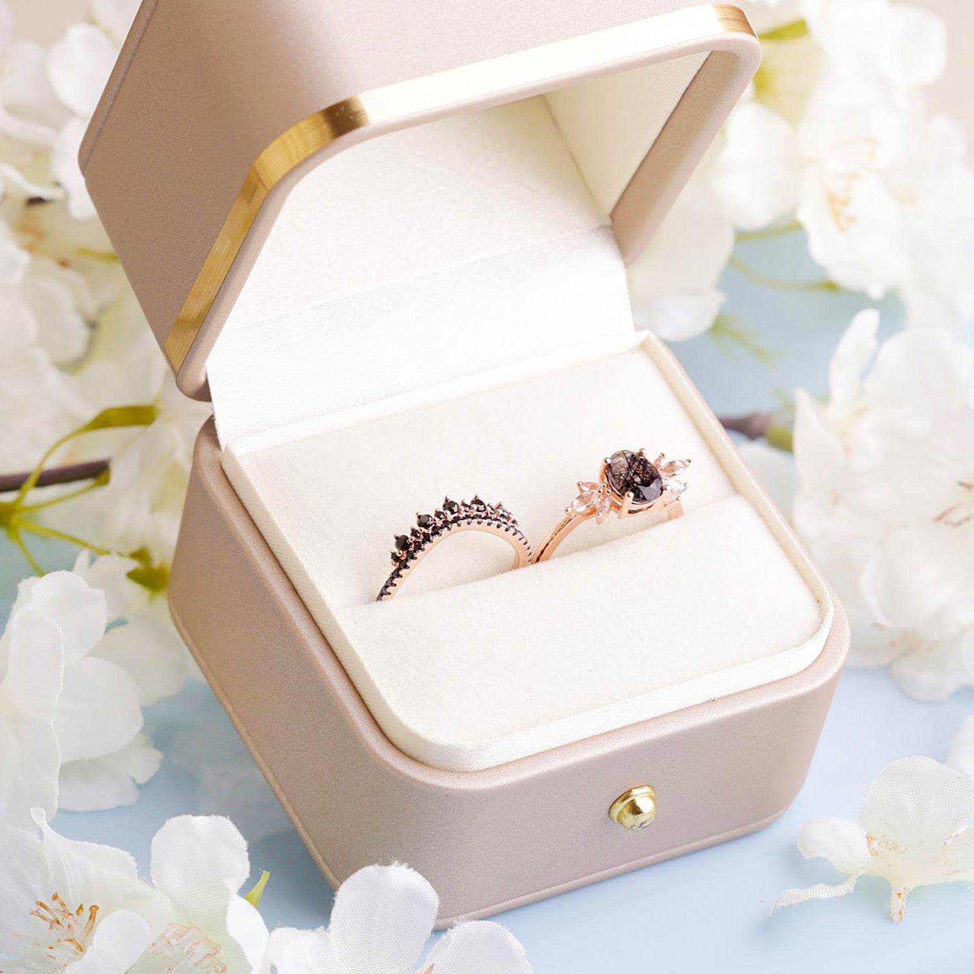 Two rings with a Black Rutilated Quartz as the main stone, White Topaz and Black Spinels in a gift box