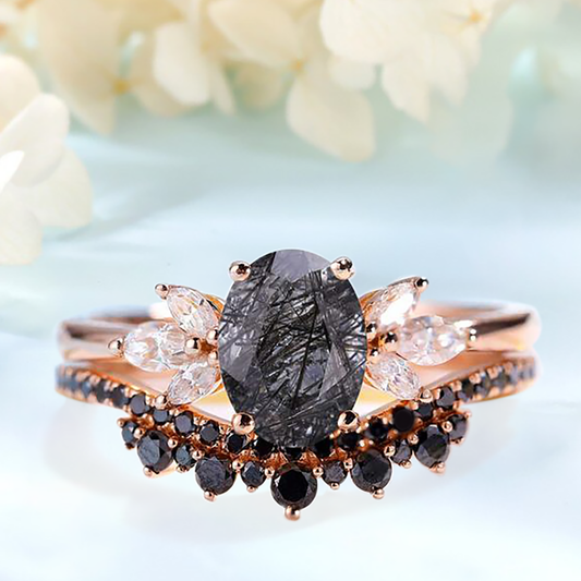 Two rings with a Black Rutilated Quartz as the main stone, White Topaz and Black Spinels