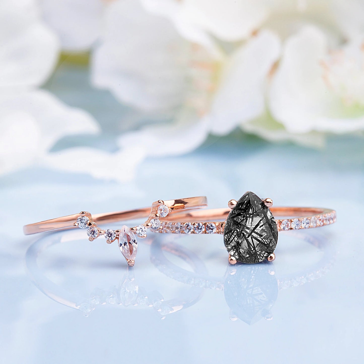 Black Rutilated Quartz, White Topaz and White Zircon rings set