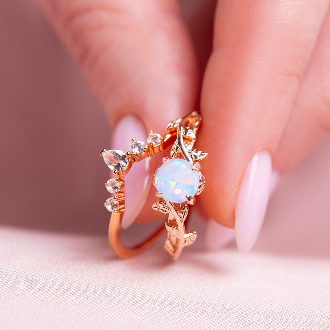 Silver Ring set for women. One ring in a form of twig with opal gemstone, another ring is v-shaped with zircon gemstones. Both rings are gold plated