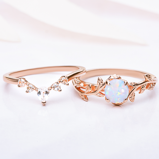 Silver Ring set for women. One ring in a form of twig with opal gemstone, another ring is v-shaped with zircon gemstones. Both rings are gold plated