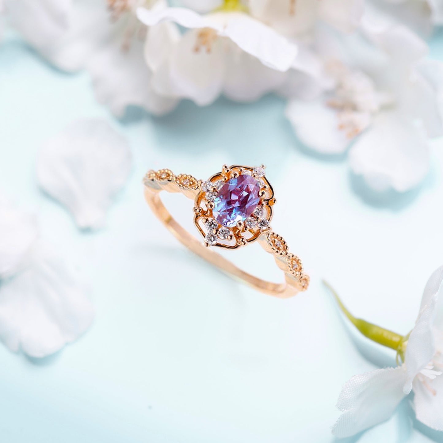 Zircon ring with an alexandrite stone with flowers on a background