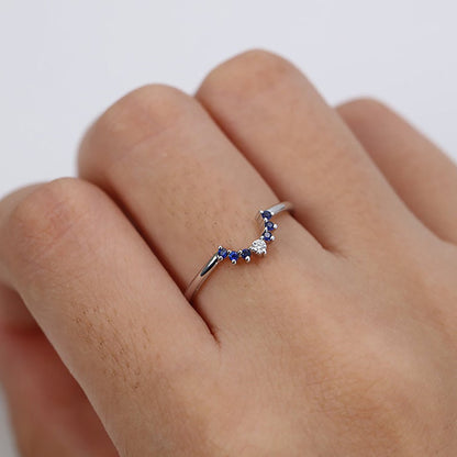 Blue Cubic Zirconia engagement ring on a woman hand