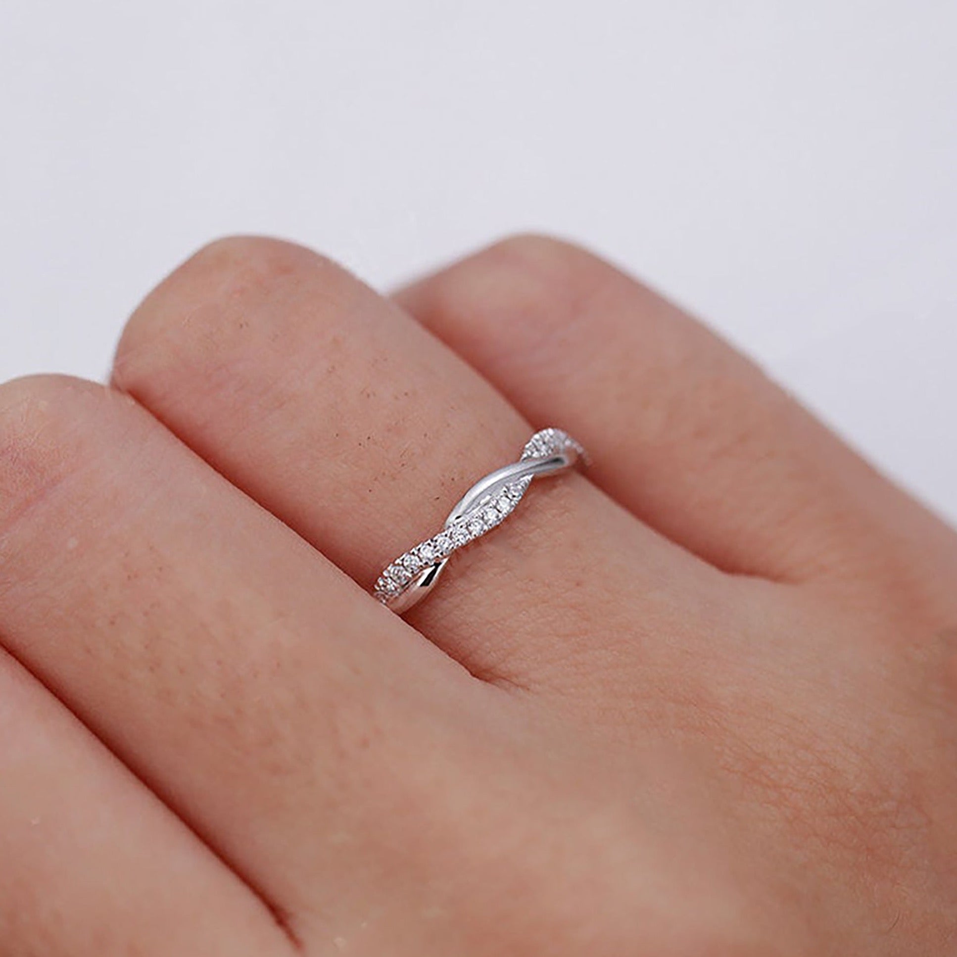 White Zircon ring on a woman hand