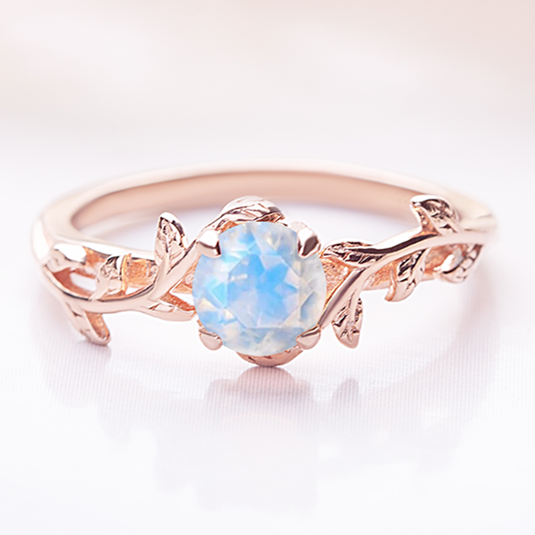 Unique leaf ring featuring a glowing moonstone, handcrafted with a nature-inspired design, perfect as an engagement or promise ring.