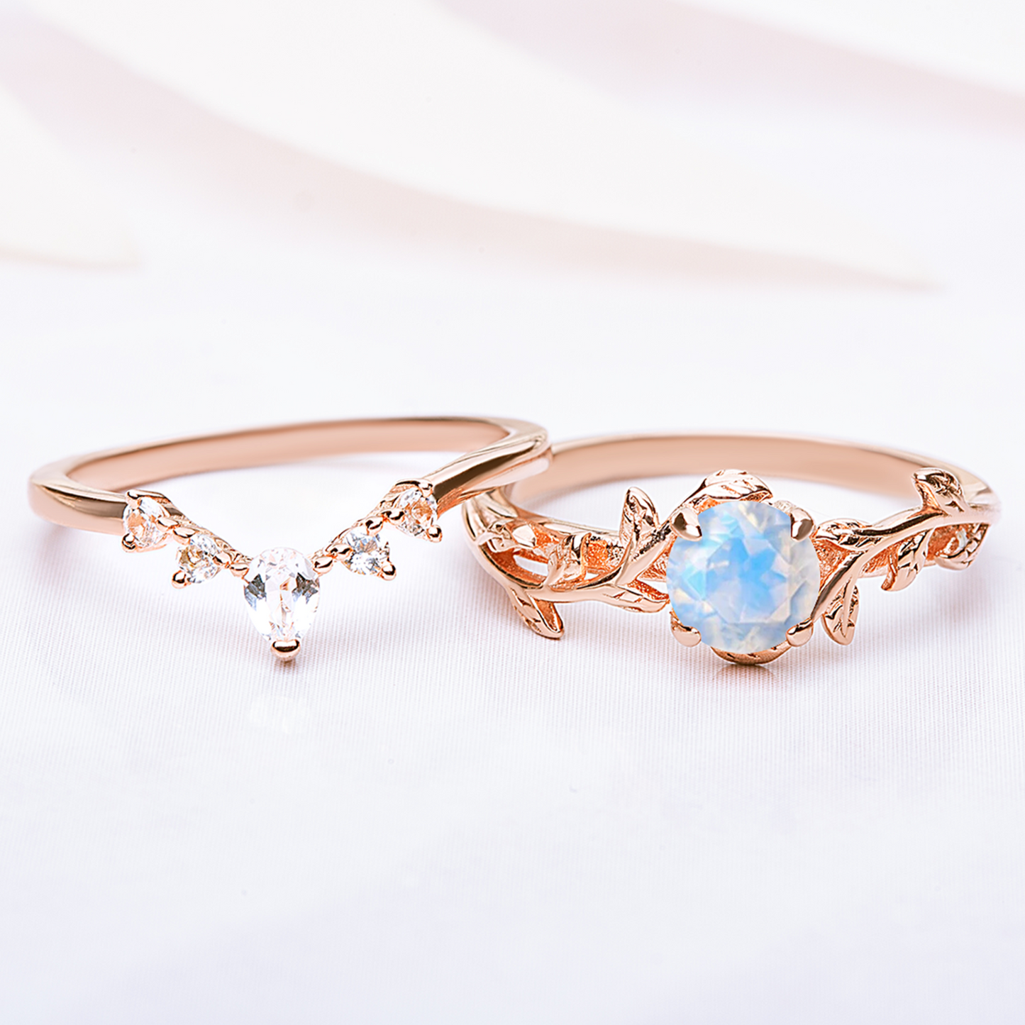 Silver Ring set for women. One ring in a form of twig with moonstone gemstone, another ring is v-shaped with zircon gemstones. Both rings are gold plated