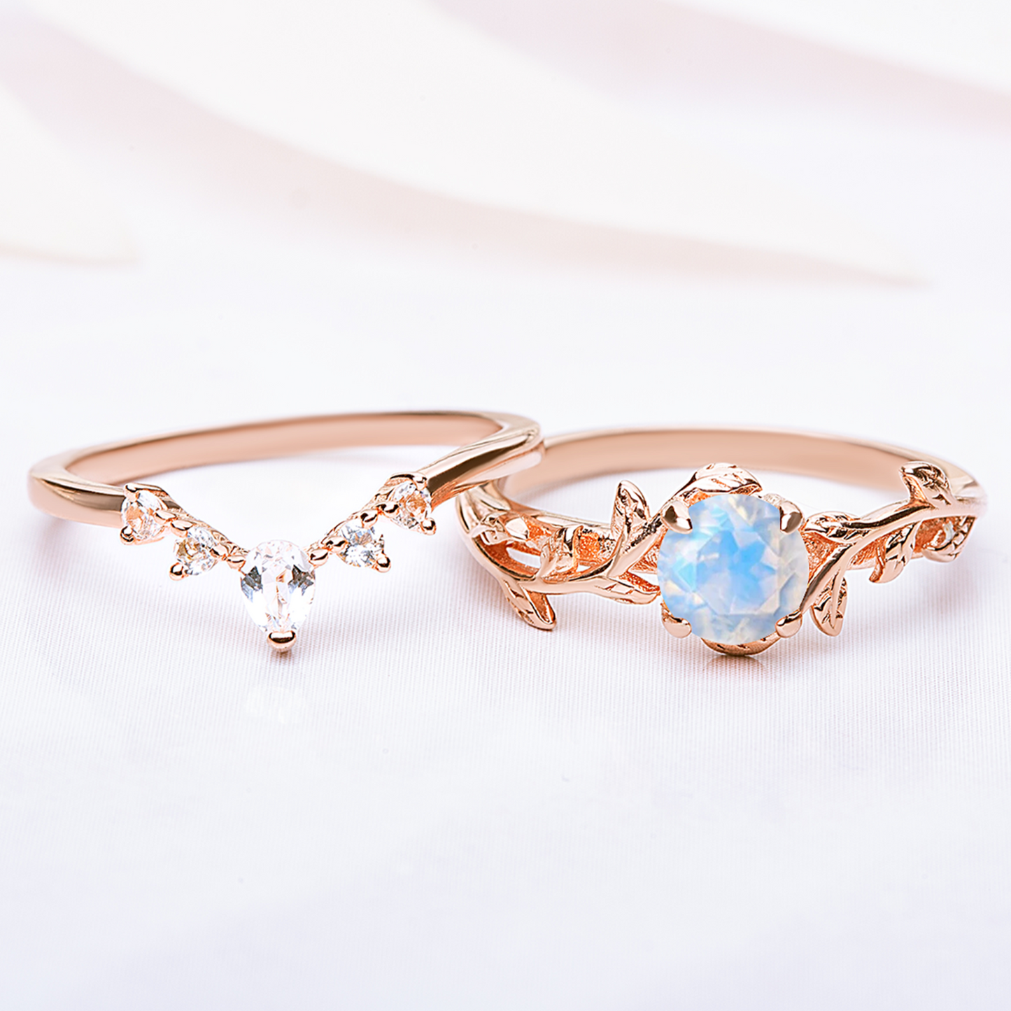 Nature-inspired Twigs Ring Set featuring moonstone and topaz gemstones with a delicate leaf design, perfect as engagement or wedding rings.