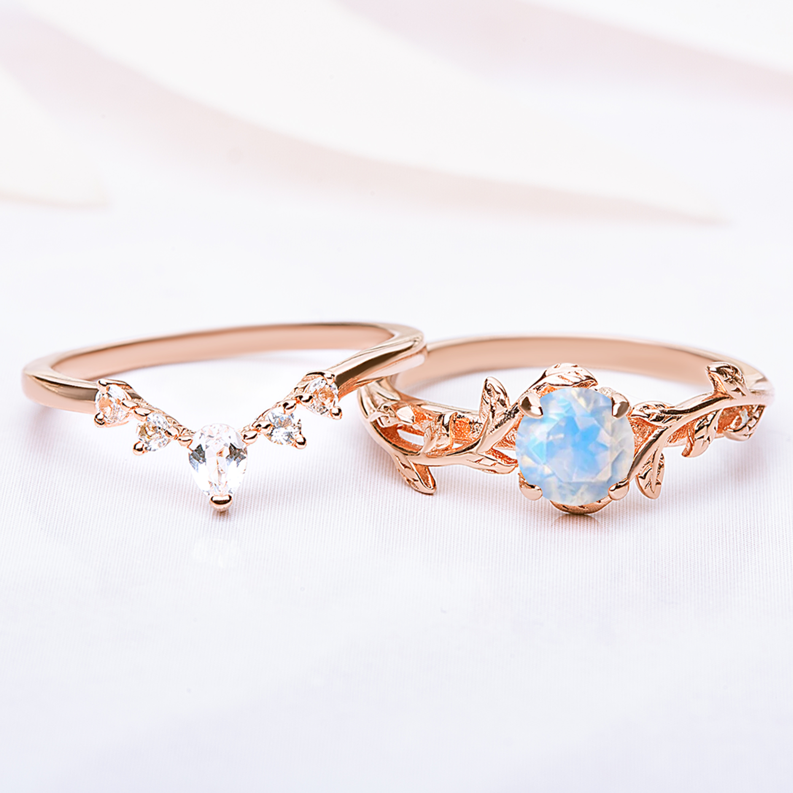 Nature-inspired Twigs Ring Set featuring moonstone and topaz gemstones with a delicate leaf design, perfect as engagement or wedding rings.