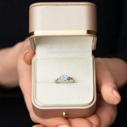 Ring with a moonstone in a twig form. View in a gift box