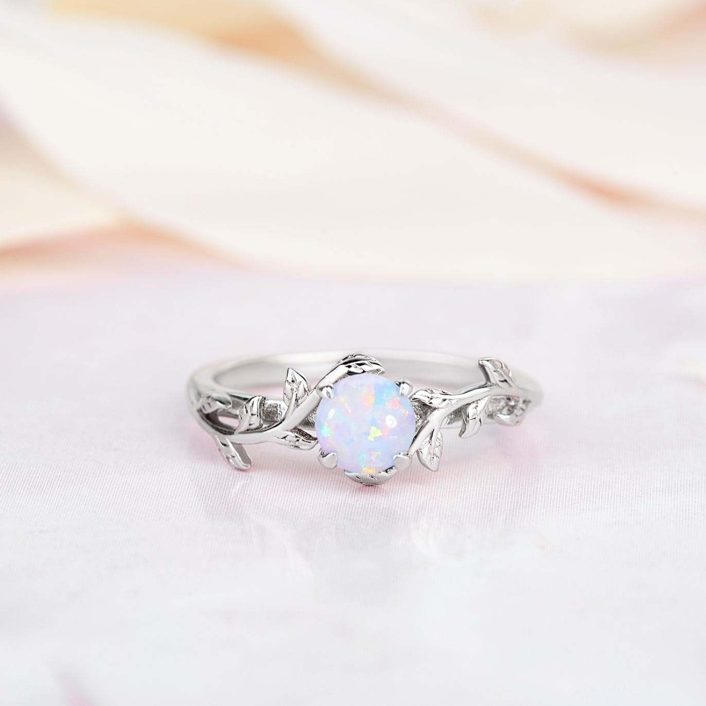 Unique opal ring with a twig band, perfect for nature lovers seeking an engagement ring, promise ring, white gold, silver.